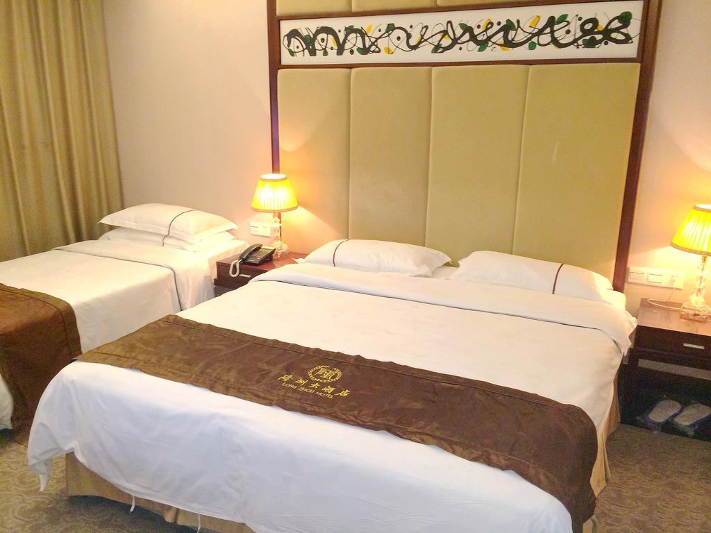 Long Zhou Grand Hotel Kanton Zimmer foto