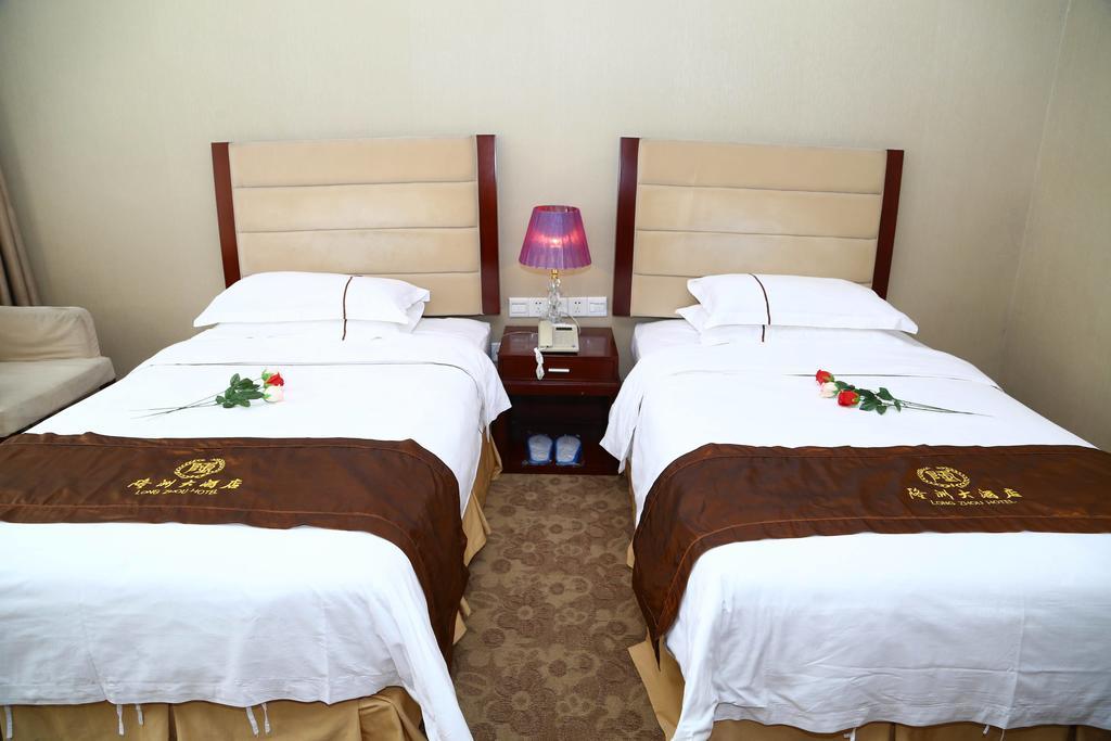 Long Zhou Grand Hotel Kanton Zimmer foto